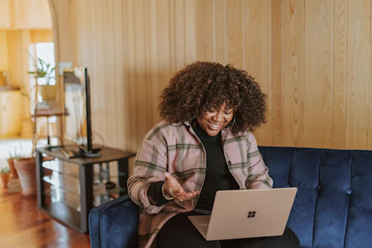 Lady in a meeting on laptop